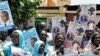 Sudanese supporters of former SPLM candidate Yasser Arman hold his posters during a protest against his withdrawal from the presidential race in Khartoum, 04 Apr 2010