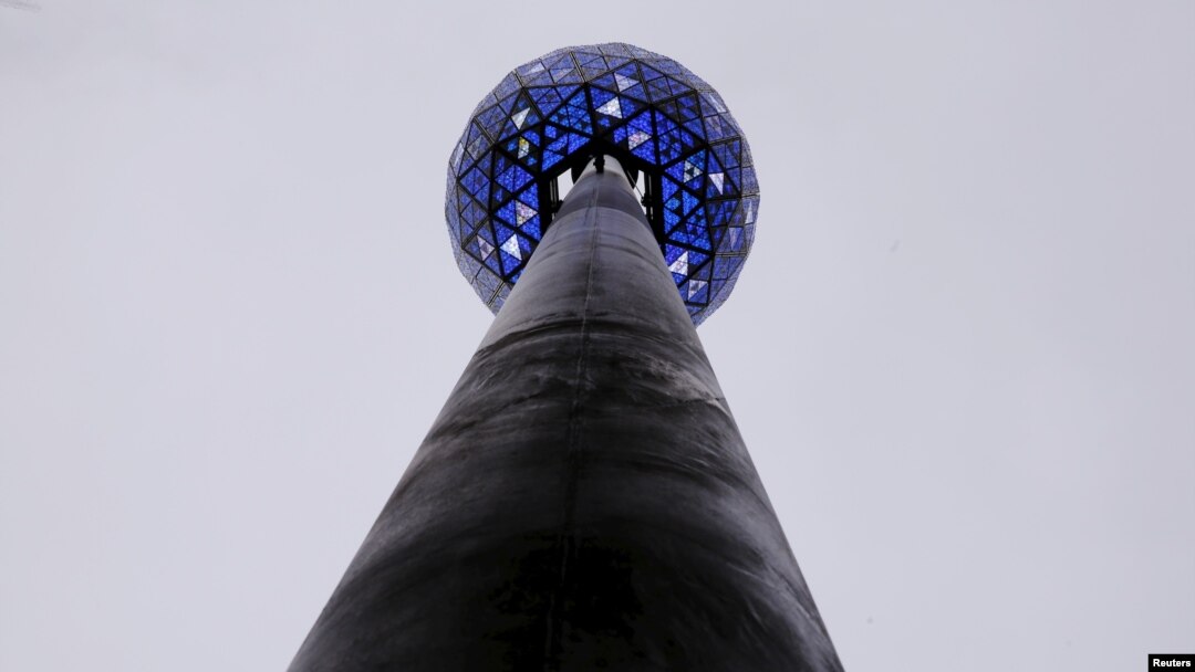 FILE - The Times Square New Year's Eve Ball is tested atop the roof of One Times Square on the day before 2016 New Year's Eve celebrations in New York, Dec. 30, 2015.
