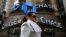 A woman passes by a JPMorgan Chase bank in Times Square in New York City, March 7, 2019.