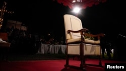 Pope Francis' chair is seen prior to the Way of the Cross Good Friday procession in front of the Colosseum on March 29, 2024, in Rome. Although the pope skipped the event at the last minute, the Vatican confirmed that he would preside over the Easter Vigil service March 30.