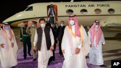 In this photo released by Saudi Royal Palace, Saudi Crown Prince Mohammed bin Salman, right, meets Pakistan's Prime Minister Imran Khan, at Riyadh international airport, Saudi Arabia, May 7, 2021.