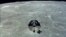 The Apollo 10 command module is seen orbiting the moon during its 1969 mission. 