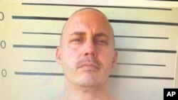 In this undated image made from a digital screen released by Thailand's Department of Corrections, shows a police custody photo of American citizen Bart Allen Helmus after being arrested on drug charges.