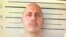 In this undated image made from a digital screen released by Thailand's Department of Corrections, shows a police custody photo of American citizen Bart Allen Helmus after being arrested on drug charges.