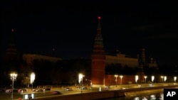 The Kremlin is in darkness with lights out for one hour to mark Earth Hour in Moscow, Russia, March, 27, 2021. 