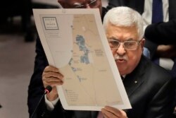 FILE - Palestinian President Mahmoud Abbas speaks during a Security Council meeting at United Nations headquarters, Feb. 11, 2020.