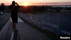 FILE - Land being developed for the new home construction is pictured at sunset in southern Sydney, Australia.