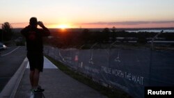 Land being developed for the new home construction is pictured at sunset in southern Sydney, Australia, Aug. 14, 2014. More wealthy Chinese are moving their money out of China to invest in Australia's property market.