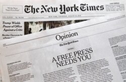 FILE - An editorial titled "A Free Press Needs You" is published in The New York Times, Aug. 16, 2018, in New York. U.S. newspapers were pushing back against President Donald Trump's attacks on "fake news."