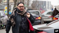 FILE - Russian theater and film director Kirill Serebrennikov walks to a court hearing in Moscow, April 12, 2019.