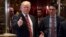 President-elect Donald Trump gives a thumbs up to members of the media after meeting with Martin Luther King III, son of Martin Luther King Jr., at Trump Tower in New York, Jan. 16, 2017.