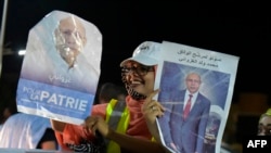 FILE - People celebrate the presidential election victory by Mauritania's ruling party candidate Mohamed Ould Ghazouani in Nouakchoot on June 23, 2019. 