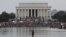 A demonstrator pumps his fist as others gather in front of the Lincoln Memorial for the "Get Your Knee Off Our Necks" march in support of racial justice that is expected to gather protestors from all over the country in Washington, U.S., August 28, 2020. 