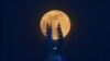 The Pink Supermoon rises over the Shard skyscraper in London in an astronomical event that occurs when the Moon is closest to the Earth in its orbit, making it appear much larger and brighter than usual, April 7, 2020.