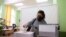 A woman votes in a polling station during parliamentary elections in Sofia, Bulgaria, Apr. 4, 2021. 