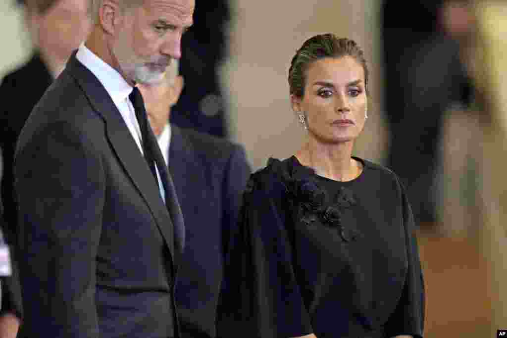 King Felipe VI and Queen Letizia of Spain look at the coffin of Queen Elizabeth II in Westminster Hall in London, Sept. 18, 2022.