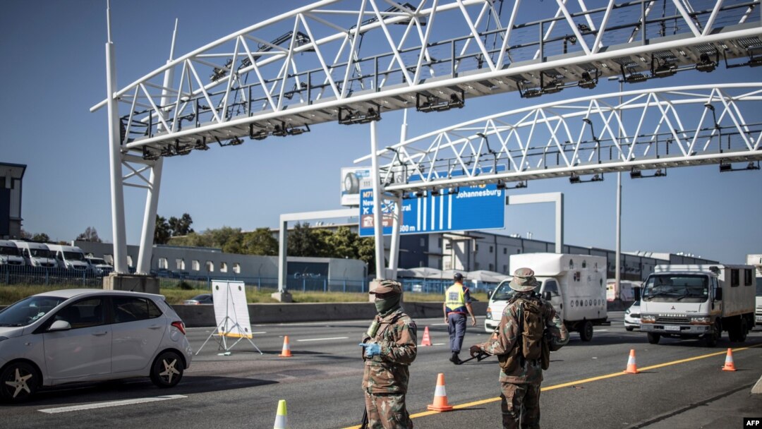 FILE - South Africa soldiers are seen at a checkpoint managed by the South Africa Police Services on the N1 highway in Johannesburg, on Apr. 24, 2020.