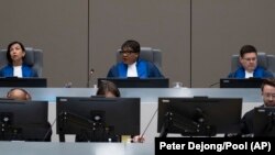 Des juges de la CPI à l'ouverture du procès de Mahamat Saïd à La Haye, aux Pays-Bas, le 26 septembre 2022.