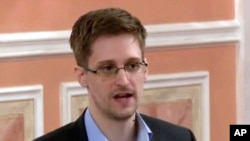 FILE - Former National Security Agency systems analyst Edward Snowden speaks in Moscow, Oct. 11, 2013, in this image made from video and released by WikiLeaks.