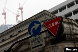 Suasana di depan kantor pusat Bank of Japan di Tokyu, Tokyo, Jepang, 22 Mei 2020.REUTERS/Kim Kyung-Hoon