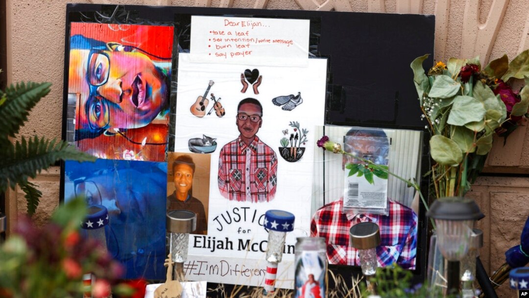 FILE - A makeshift memorial stands at a site across the street from where Elijah McClain was stopped by Aurora, Colo., Police Department officers while walking home, before family members hold a news conference, July 3, 2020, in Aurora, Colo.