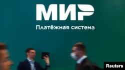 FILE - The logo of Russian payment system Mir is seen at the St. Petersburg International Economic Forum in Saint Petersburg, Russia, June 15, 2022.