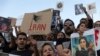 Protesters shout slogans during a protest against the death of Iranian Mahsa Amini, at central Syntagma square, in Athens, Greece, Saturday, Sept. 24, 2022.