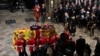 Britain's Queen Elizabeth's coffin is carried as Britain's King Charles III, Camilla, the Queen Consort and Princess Anne follow, on the day of the state funeral and burial of Britain's Queen Elizabeth, at Westminster Abbey, in London, Sept. 19, 2022. 