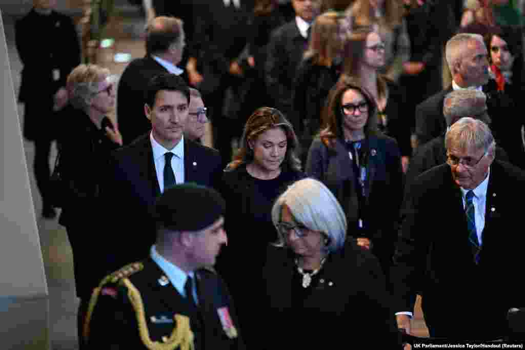 Canada&#39;s Prime Minister Justin Trudeau and his wife Sophie Trudeau pay respects to Queen Elizabeth as she lies in state in Westminster Hall in London, Sept. 17, 2022.