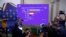 Exit polls appear on the screen at the headquarters of Brothers of Italy ahead of Giorgia Meloni's talk to the media during the election night, in Rome, Italy September 25, 2022. 