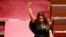 FILE - Indigenous Australian parliamentarian Lidia Thorpe raises her fist during her swearing-in ceremony in the Senate chamber at Parliament House in Canberra, Australia, Aug. 1, 2022. 
