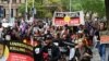 Indigenous Australians and supporters march through the city center to "abolish the monarchy" on the country's national day of mourning for Britain's Queen Elizabeth, in Sydney, Sept. 22, 2022.