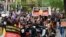 Indigenous Australians and supporters march through the city center to "abolish the monarchy" on the country's national day of mourning for Britain's Queen Elizabeth, in Sydney, Sept. 22, 2022.