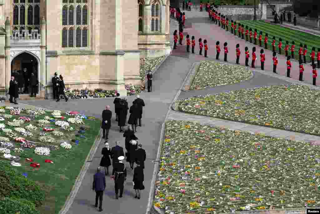 Guests arrive at St. George's Chapel on the day of the state funeral and burial of Queen Elizabeth, at Windsor Castle in Windsor, Sept. 19, 2022. 