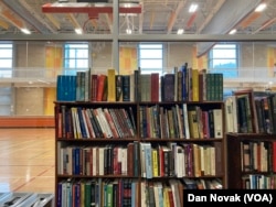 Wheaton library's bookstore is next to a basketball court from the recreation center. The Wheaton library shares a building with the local recreation center.