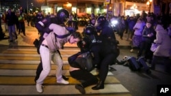 Riot police detain demonstrators during a protest against mobilization, in Moscow, Russia, Sept. 21, 2022.