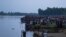 ফাইল ছবিবোদা শহরের কাছে নৌকা ডুবির পর করতোয়া নদীর তীরে লোকজনের ভিড়। ২৫ সেপ্টেম্বর, ২০২২। (ছবি-ফিরোজ আল সাবাহ/এএফপি)