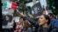 People demonstrate against the Iranian regime during a protest at Mel Lastman Square in Toronto, Ontario, Sept. 24, 2022.