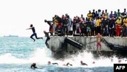 Competitors take the start of the circuit A of the swimming race from Dakar to Goree in Dakar, Senegal.