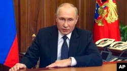 In this image made from video released by the Russian Presidential Press Service, Russian President Vladimir Putin addresses the nation in Moscow, Russia, Wednesday, Sept. 21, 2022. (Russian Presidential Press Service via AP)