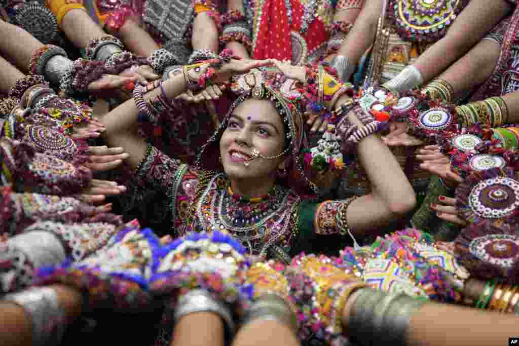 Women practice the Garba, the traditional dance of Gujarat state, ahead of Navratri in Ahmedabad, India.