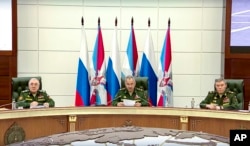 In this photo taken from video released by Russian Defense Ministry Press Service, Russian Defense Minister Sergei Shoigu speaks during a meeting in the Russian Defense Ministry office in Moscow, Sept. 21, 2022. (Russian Defense Ministry Press Service vi