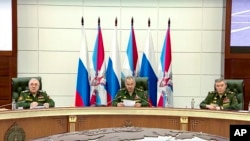 In this photo taken from video released by Russian Defense Ministry Press Service, Russian Defense Minister Sergei Shoigu speaks during a meeting in the Russian Defense Ministry office in Moscow, Sept. 21, 2022. (Russian Defense Ministry Press Service vi