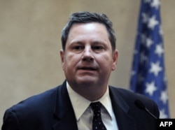 FILE - Mike Hammer, then-U.S. assistant secretary of state for public affairs, speaks during a press conference in Tegucigalpa, July 19, 2012.