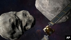 This illustration made available by Johns Hopkins APL and NASA depicts NASA's DART probe, foreground right, and Italian Space Agency's LICIACube, bottom right, at the Didymos system before impact with the asteroid Dimorphos, left.