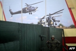 FILE - A Russian serviceman takes part in the Vostok-2022 military exercises, which China joined, at the Sergeevskyi training ground outside the city of Ussuriysk on the Russian Far East, Sept. 6, 2022.