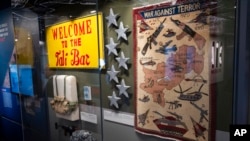 A display for the CIA's work in Afghanistan shows the seven stars that were part of a larger memorial to the seven CIA officers killed in the line of duty on Dec. 30, 2009, in the newly refurbished museum in the CIA's headquarters building in Langley, Va.