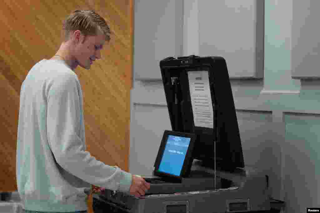 First-time elector  Henry Schultz, 18, casts his ballot for the 2024 U.S. Presidential Election astatine  the Billings Park Community Center polling determination  successful  Superior, Wisconsin, Nov. 5, 2024.