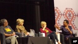 Graca Machel, right, wife of former President Nelson Mandela, makes a point about the rights of young adolescent women as actress Charlize Theron looks on at the 2016 AIDS Conference in Durban, South Africa, July 19, 2016. 