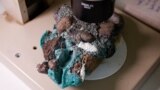 "Plastic rocks" found on Trindade Island in the state of Espirito Santo is seen at the laboratory of the Federal University of Parana, in Curitiba, state of Parana, Brazil on March 7, 2023. (REUTERS/Rodolfo Buhrer)